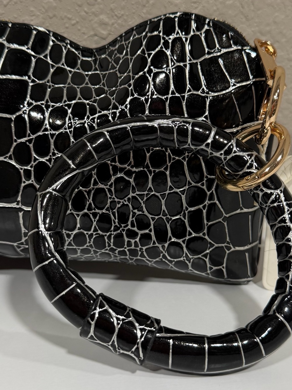 Black Croc-Embossed Wristlet with Gold Ring Accent